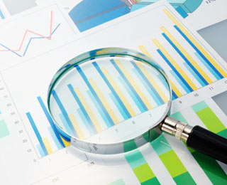 magnifying glass over graphs